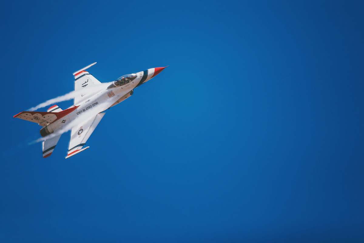 airplane white and red jet plane hovering on sky at daytime aircraft