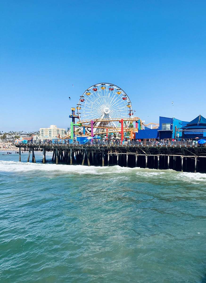 waterfront ferris wheel near body of water during daytime dock
