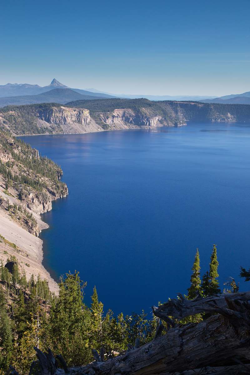 lake landscape photo of mountain near body of water tree