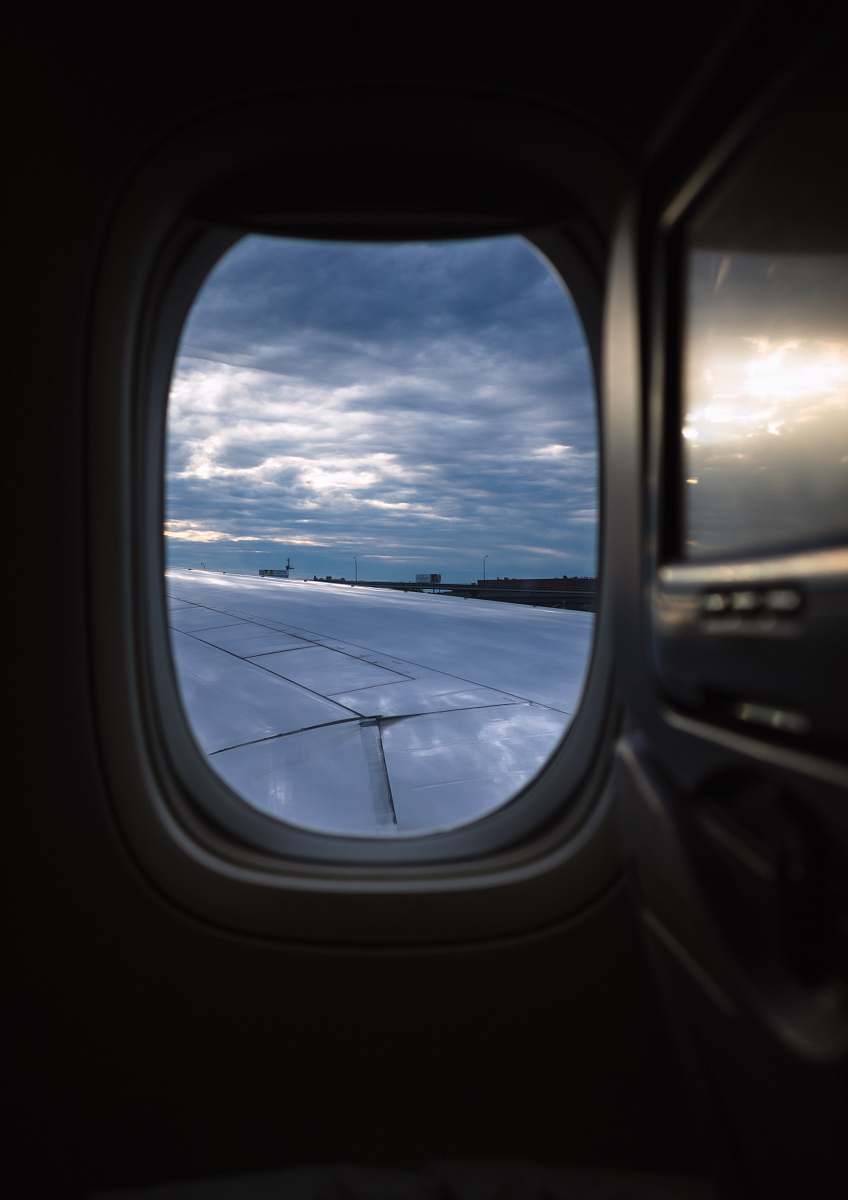 porthole airliner view photography of sky newark liberty international airport