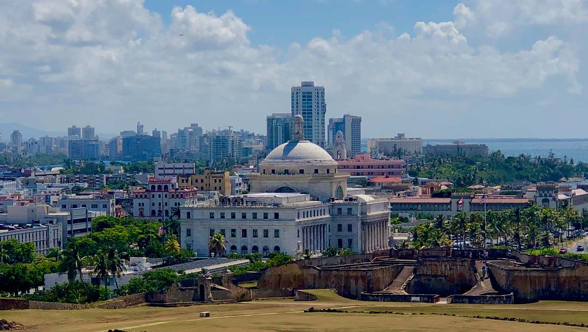 building aerial photo of city buildings under cloudy sky dome