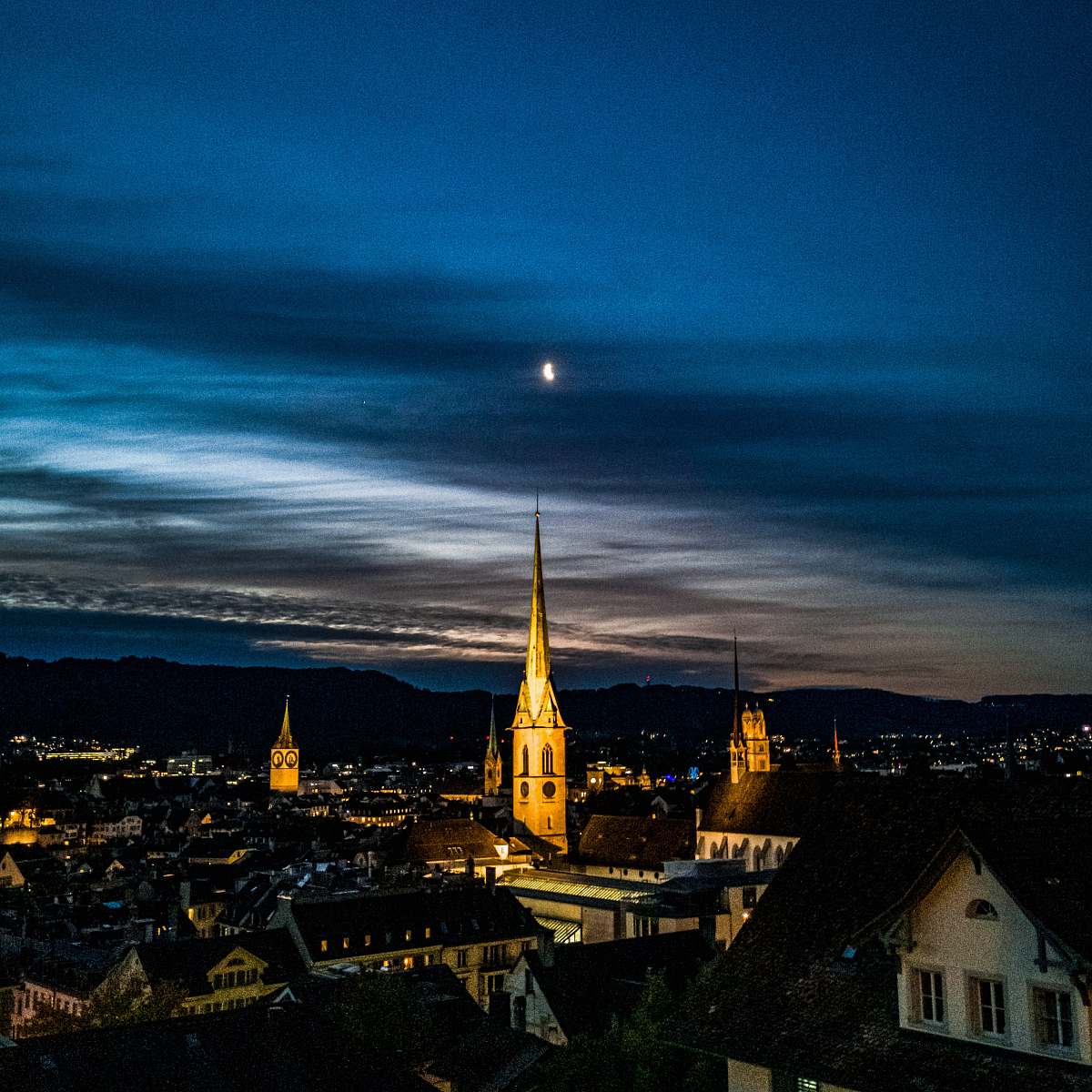 building aerial photography of buildings under blue sky spire