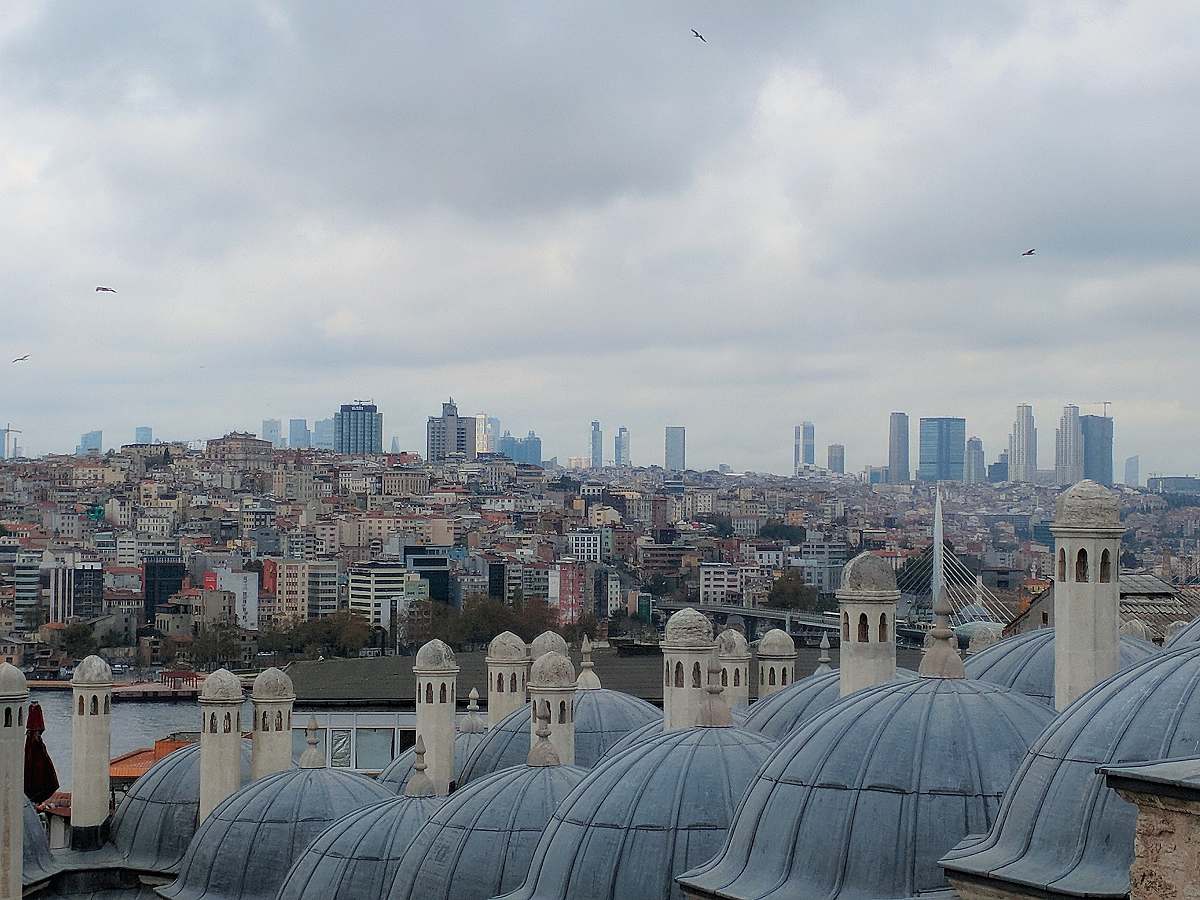 building aerial photography of buildings under cloudy sky dome