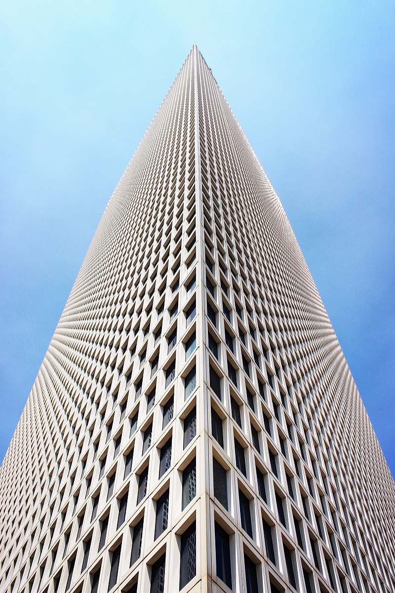 building architectural and low-angle photo of white high rise building city