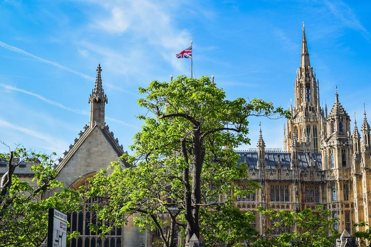building architectural photography of brown and blue house spire
