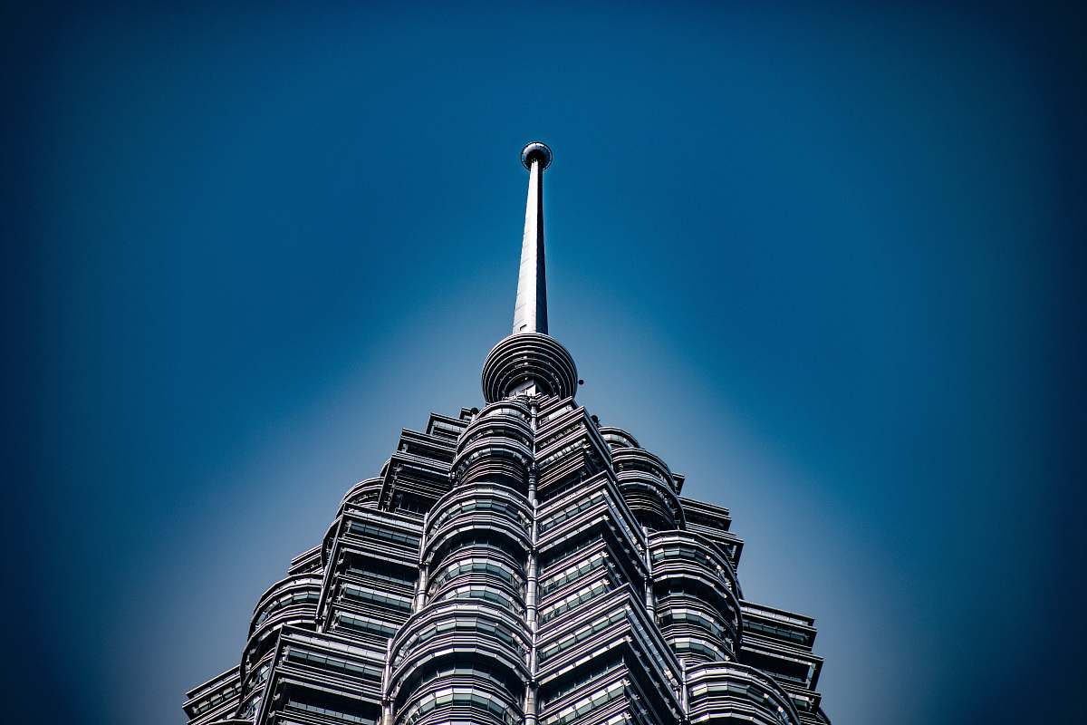 spire architectural photography of gray building steeple