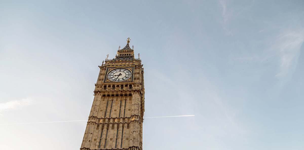 tower Big Ben under blue sky during daytime clock tower
