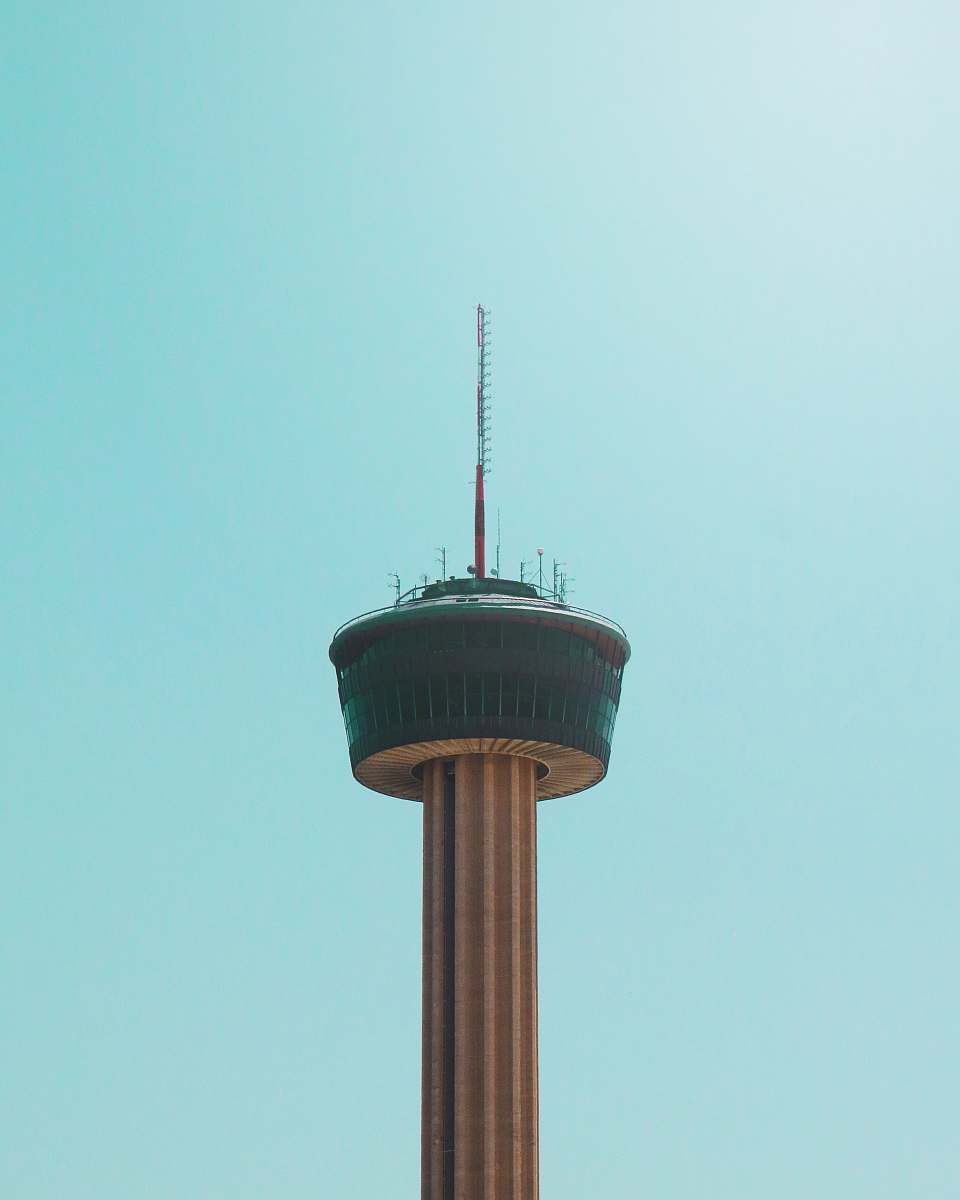 building black and white tower during daytime tower