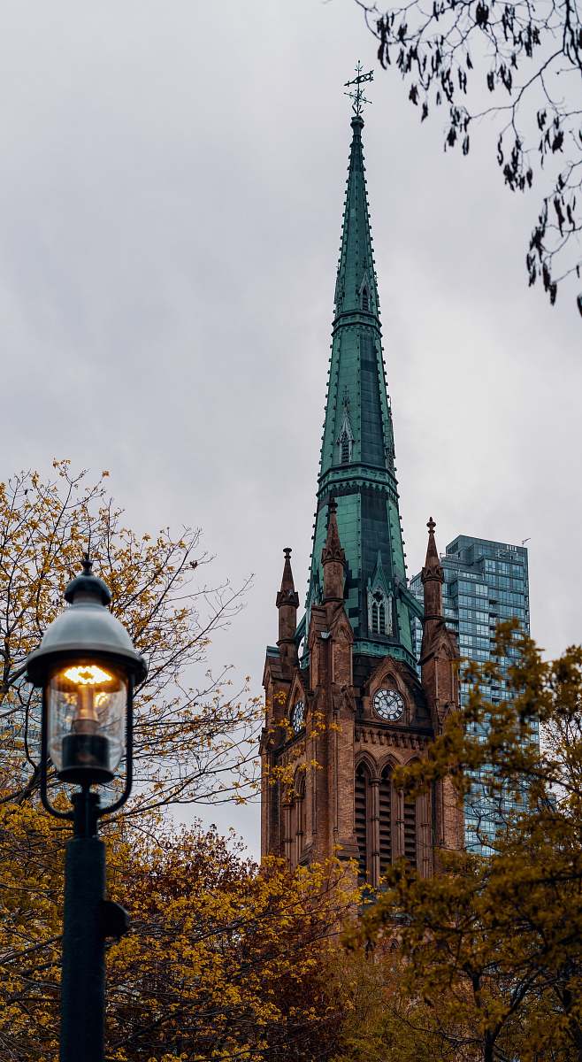building blue and green tower clock spire