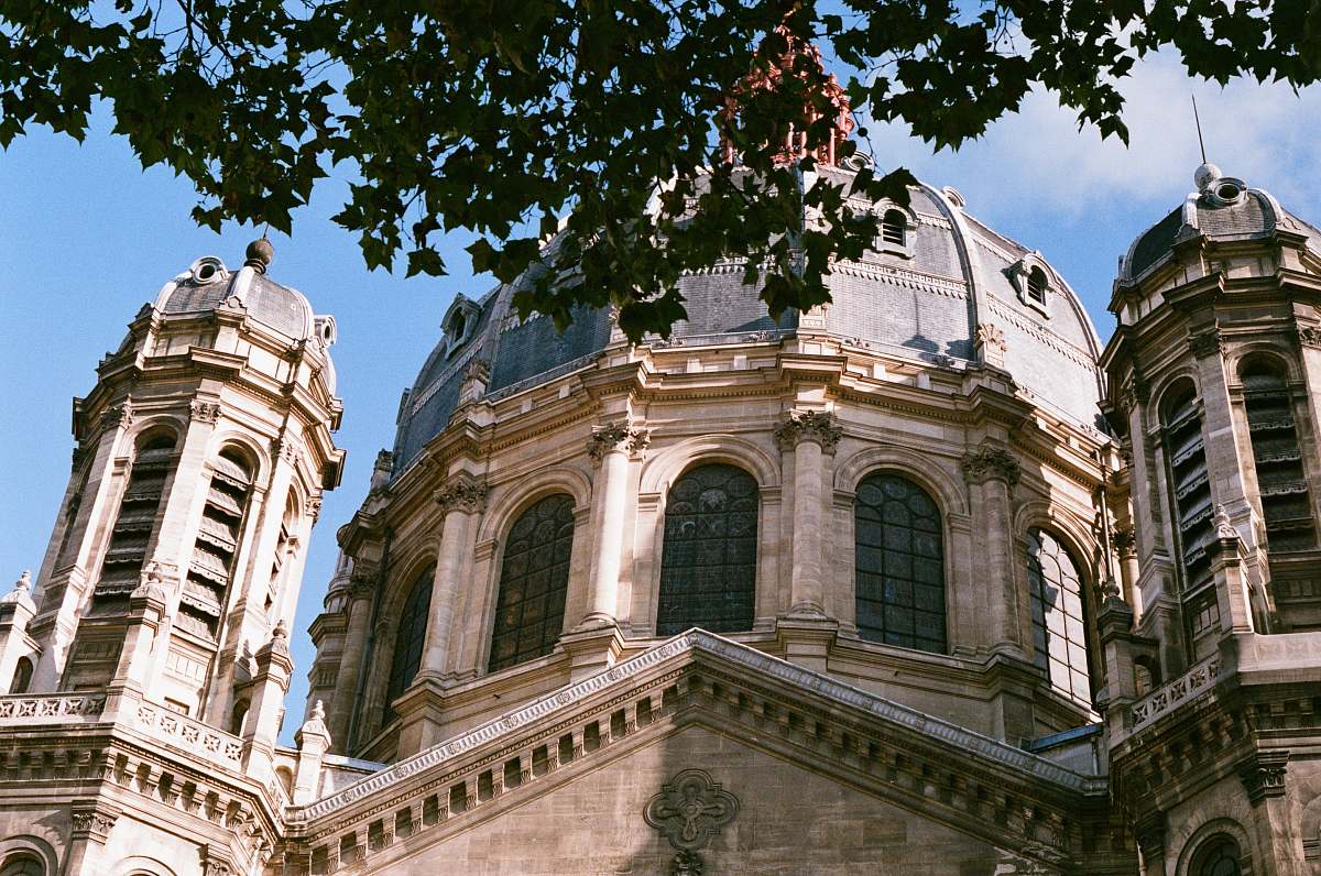building brown and white dome building under blue sky dome