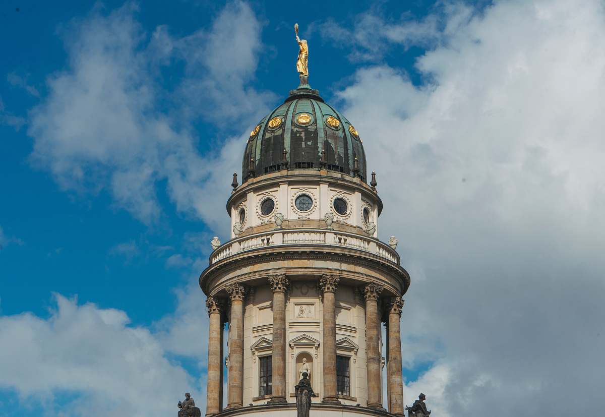 building brown and white tower under white and blue sky at daytime dome