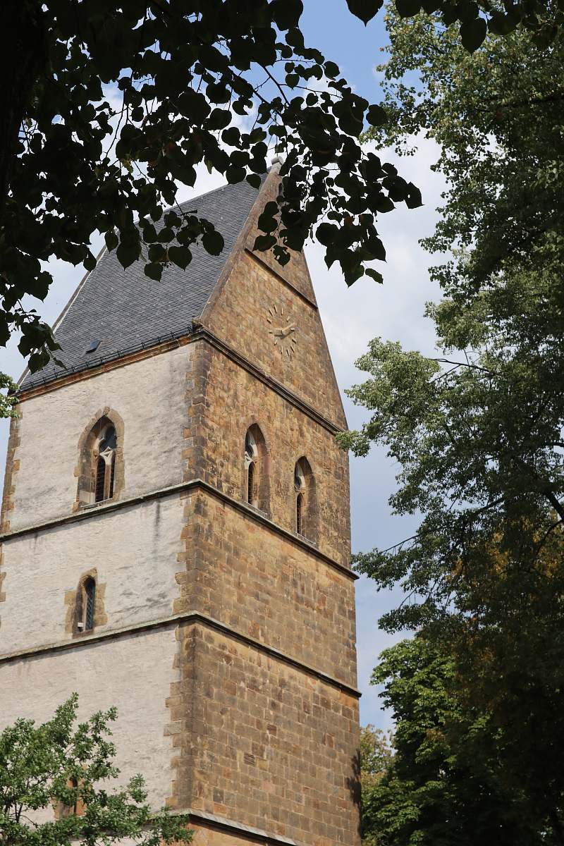 building brown brick building spire