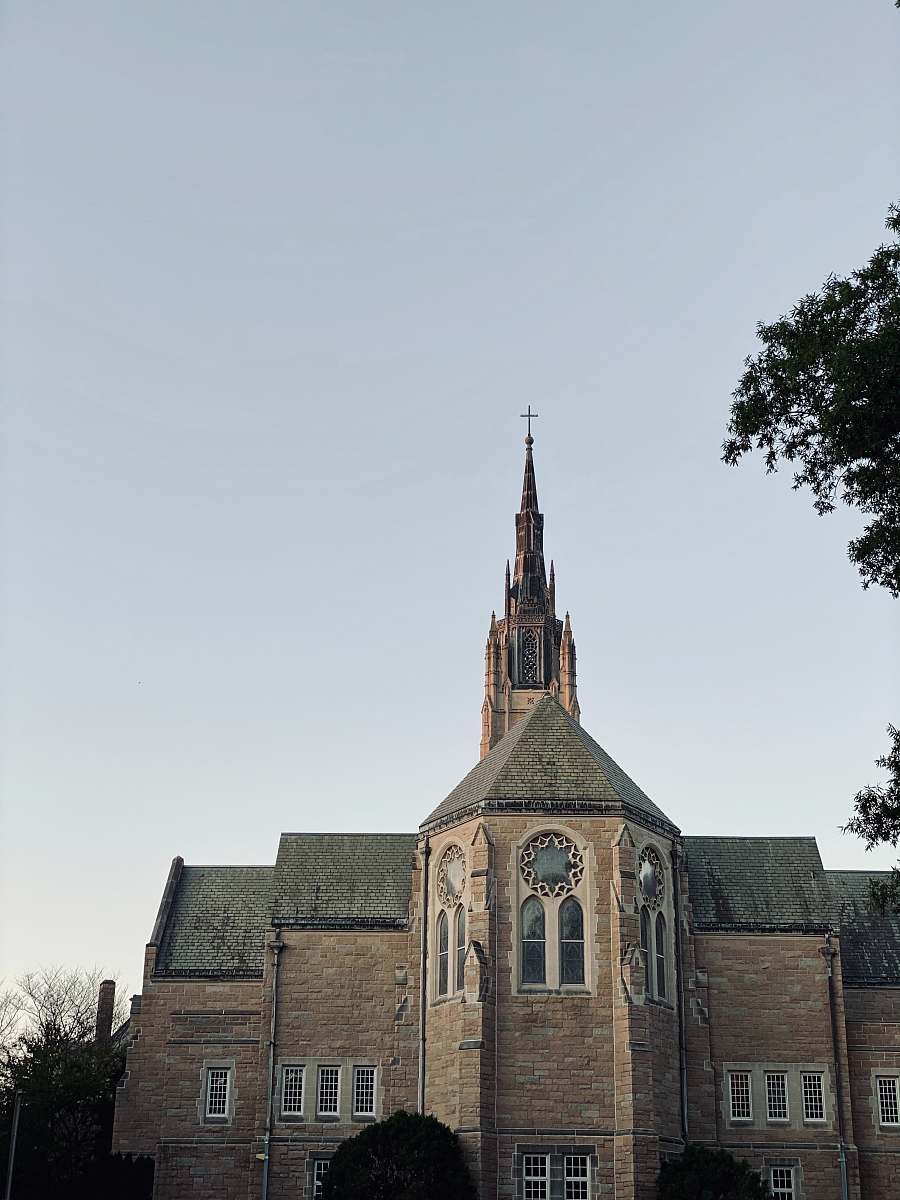 building brown cathedral during day steeple