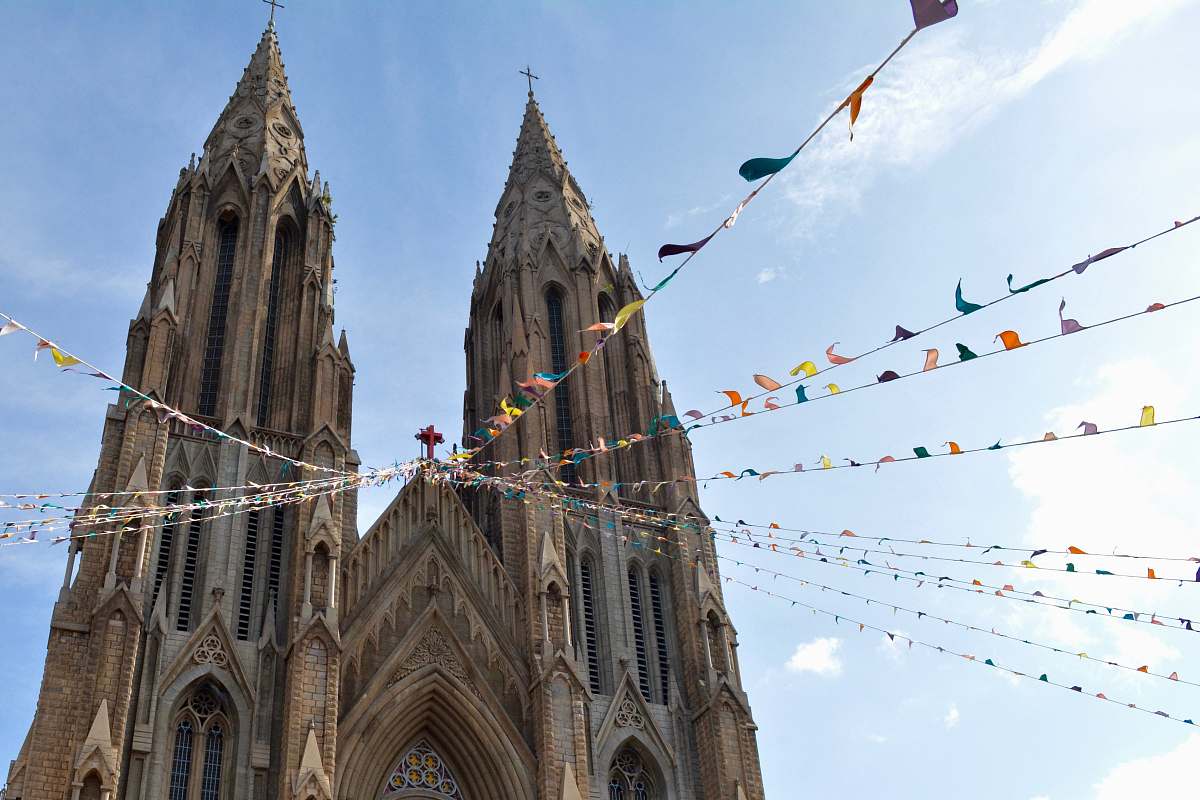 building brown church under blue sky spire