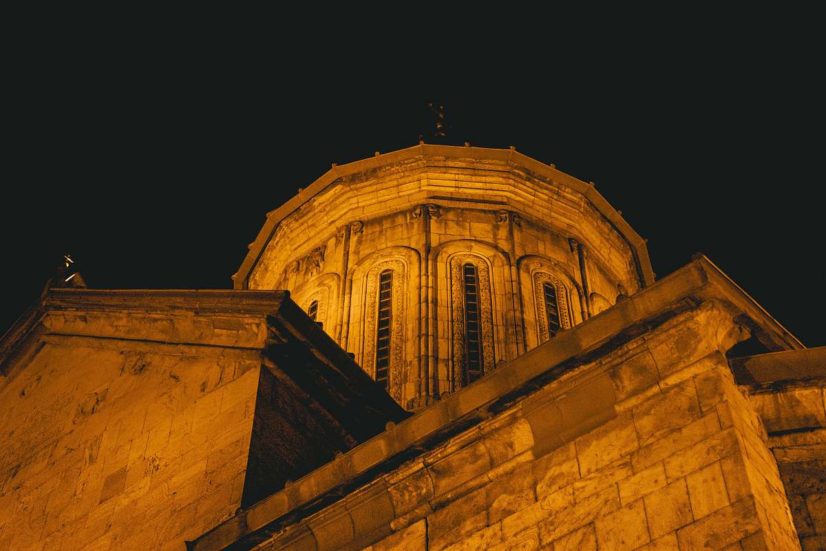 building brown concrete building at nighttime close-up photography dome