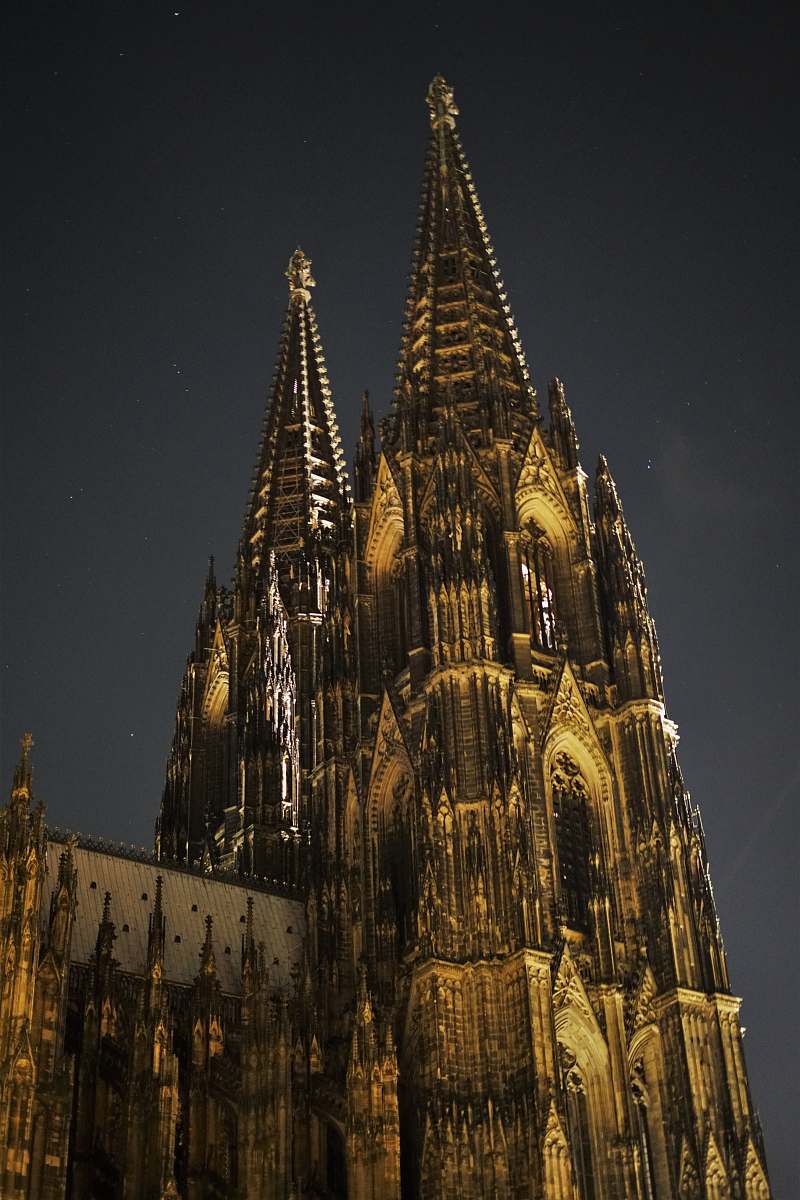building brown concrete building during night spire