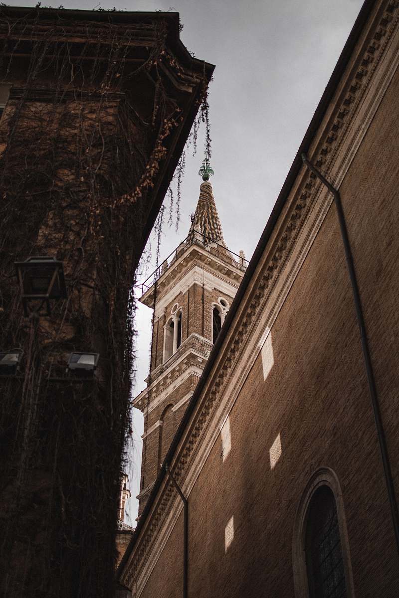 building brown concrete tower during daytime spire