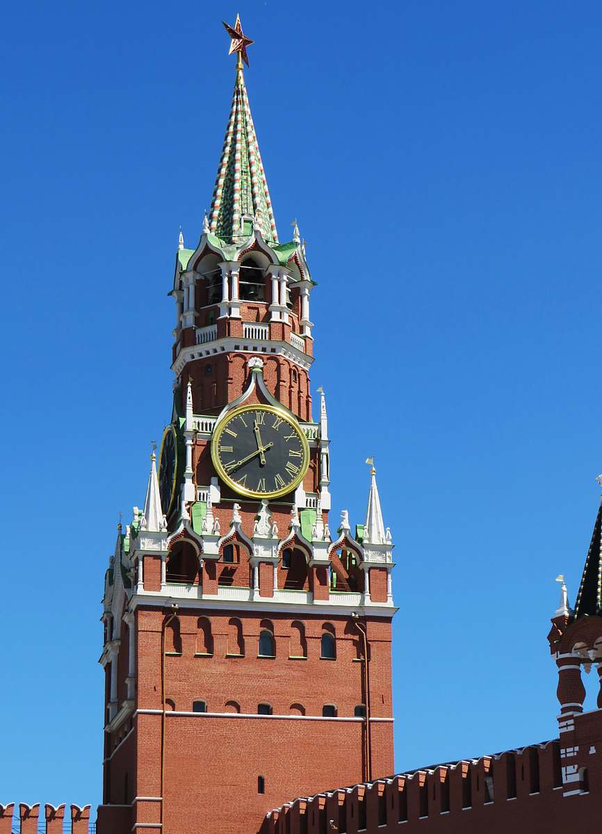 building brown, green and white clock tower tower
