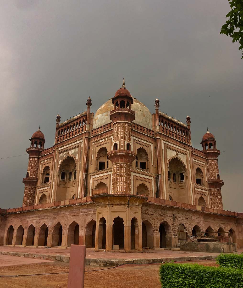 building brown mosque under gray sky dome