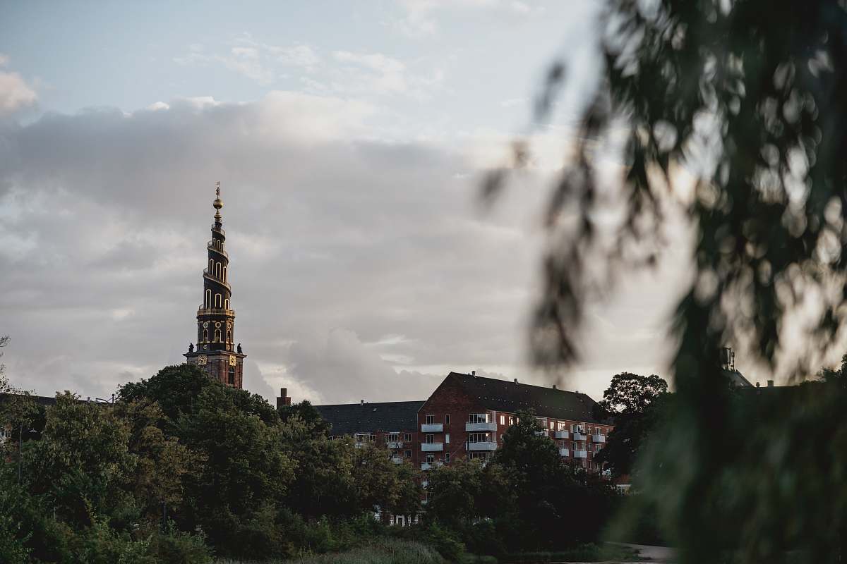 building brown tower during daytime spire