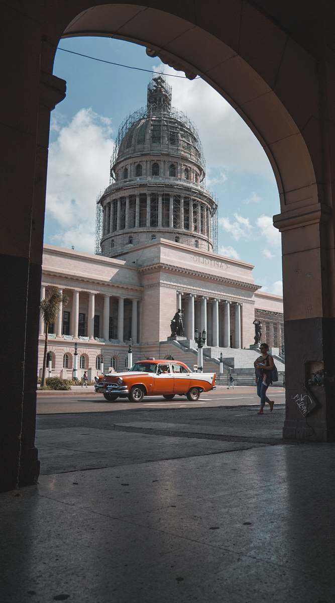 building car on road near building dome