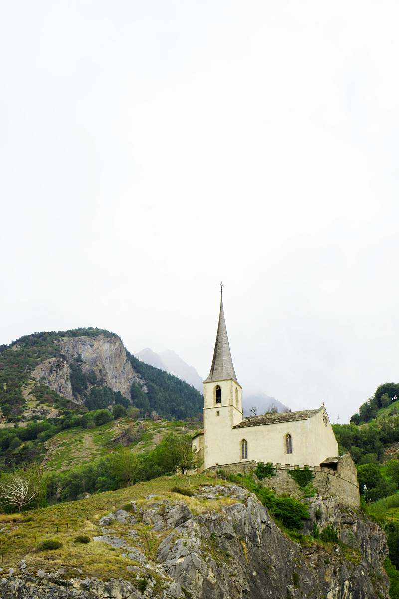 spire church on hill building