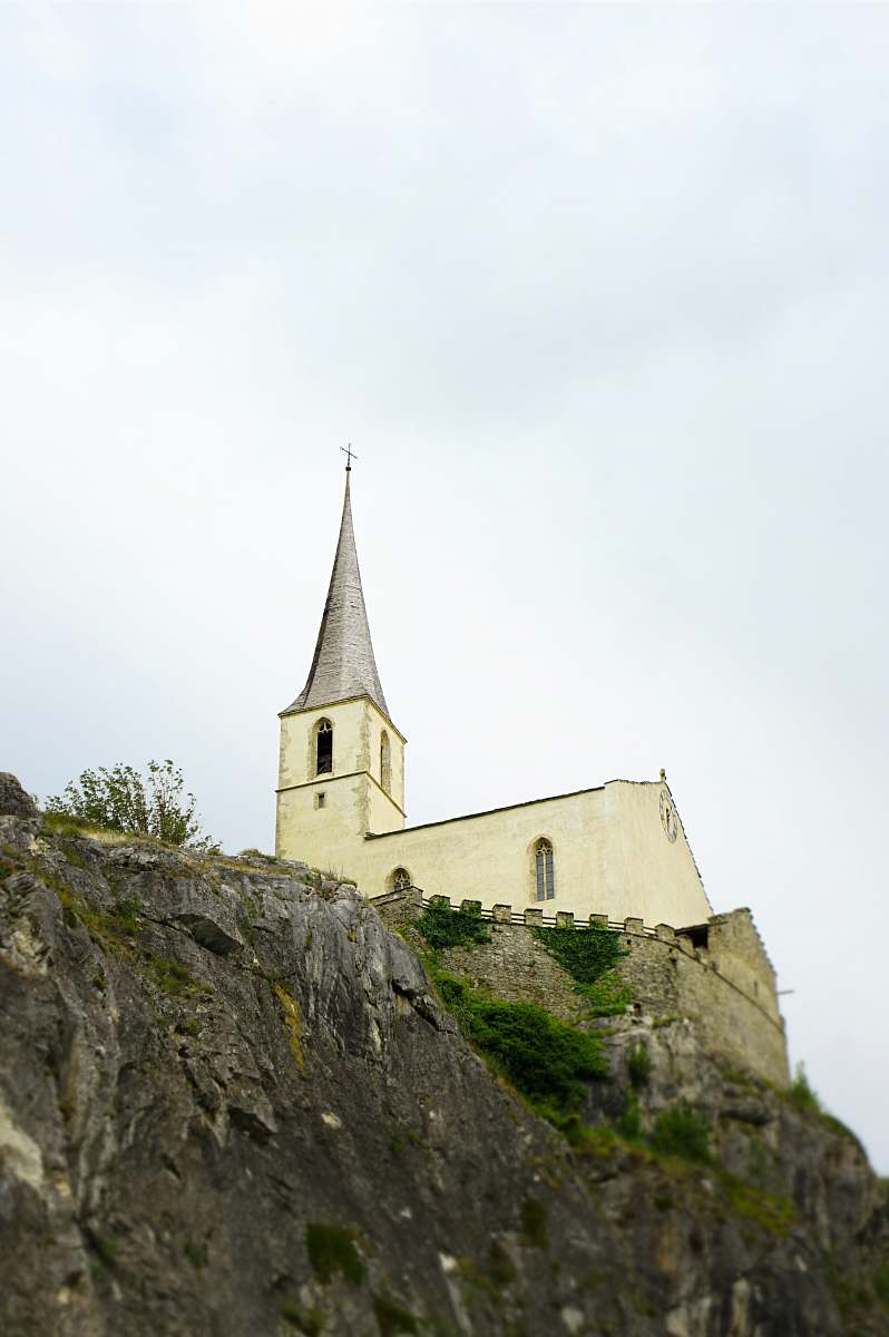 building church on mountain during day spire