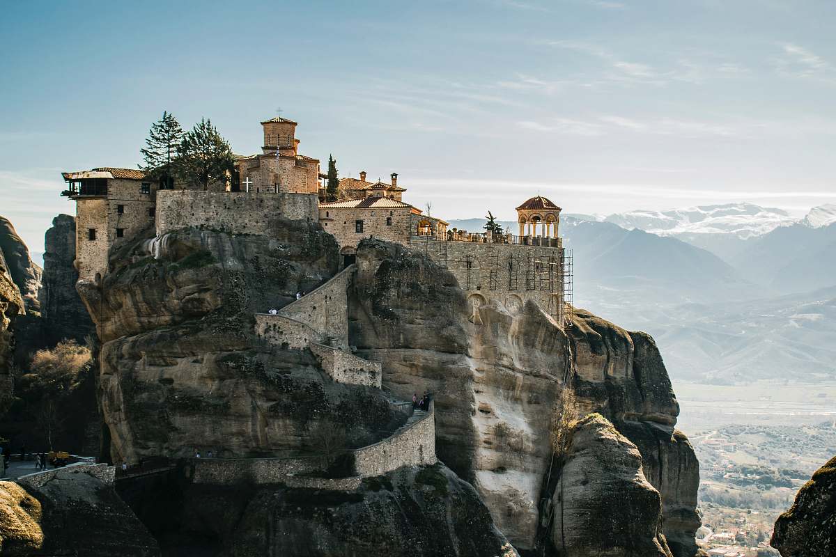 building city on top of rock formation during daytime housing