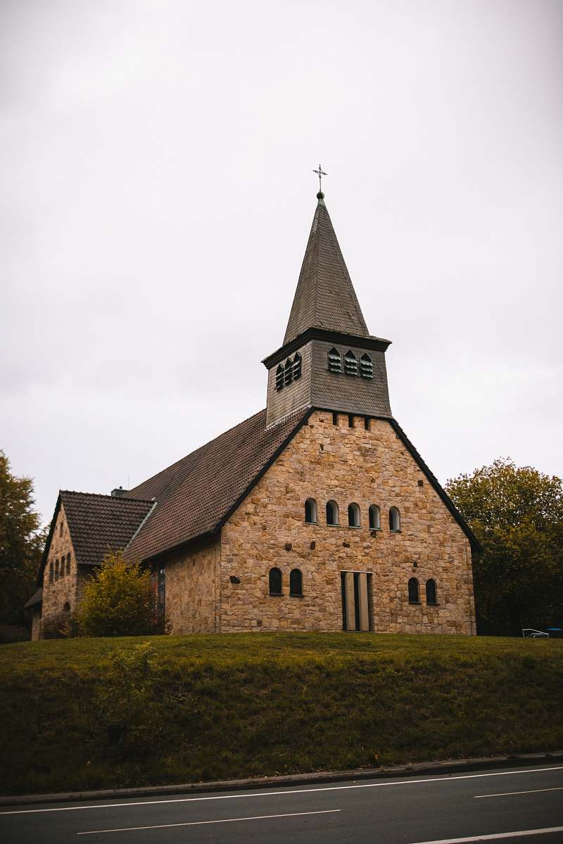 building gray and brown concrete church during daytime spire