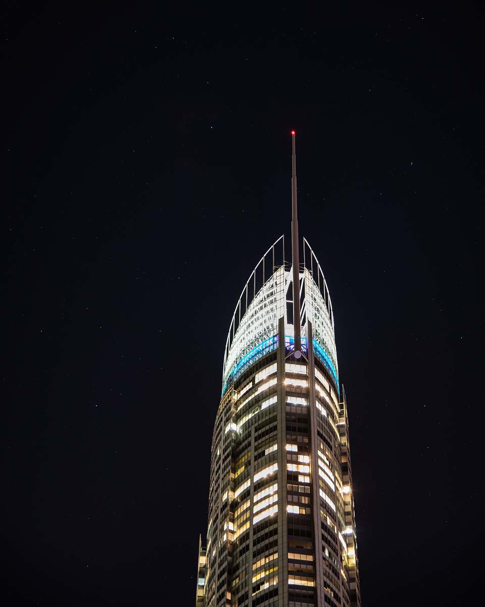 spire gray building under clear night sky tower
