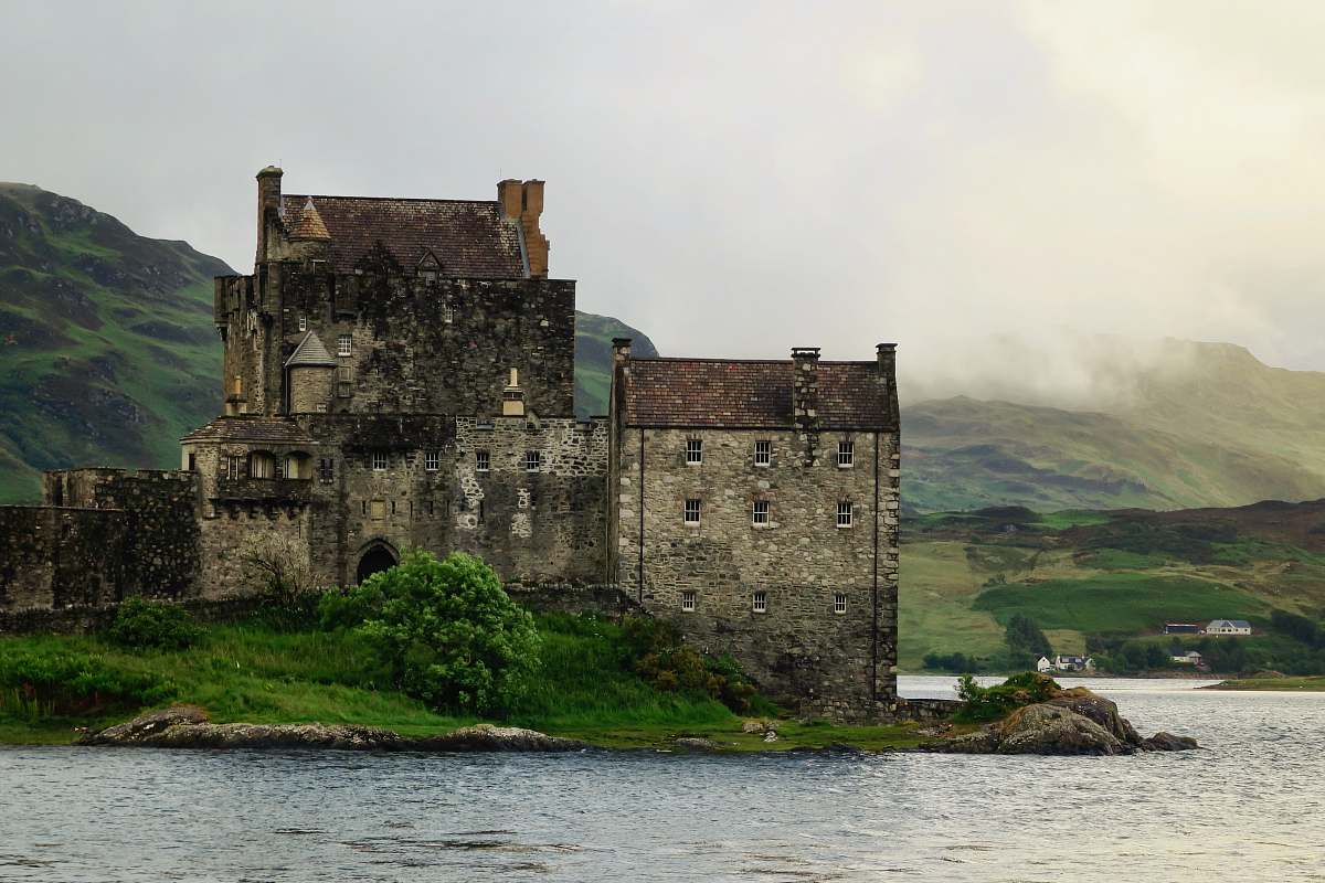 building gray castle on shore castle