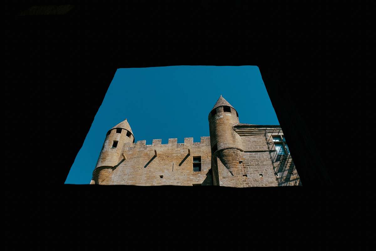 building gray concrete castle under blue sky castle