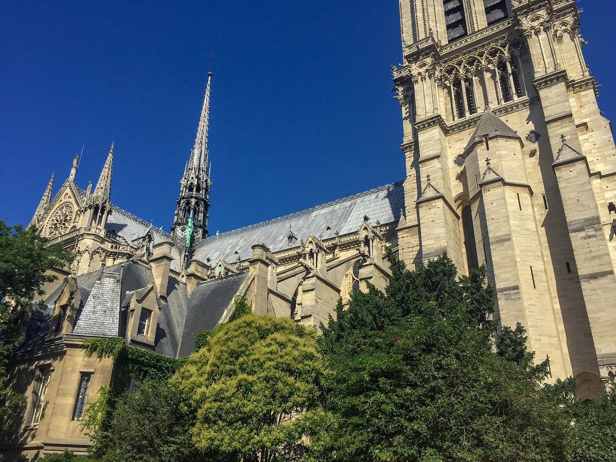 building gray concrete cathedral under blue sky spire