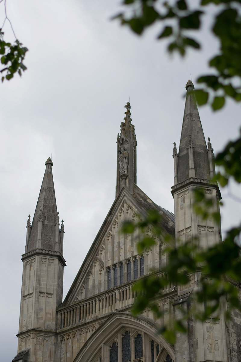 building gray concrete cathedral under gray sky spire