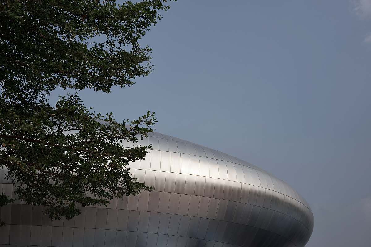 building gray metal building during daytime planetarium