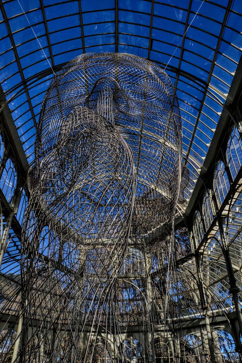 window gray metal mesh under blue arch glass roof skylight