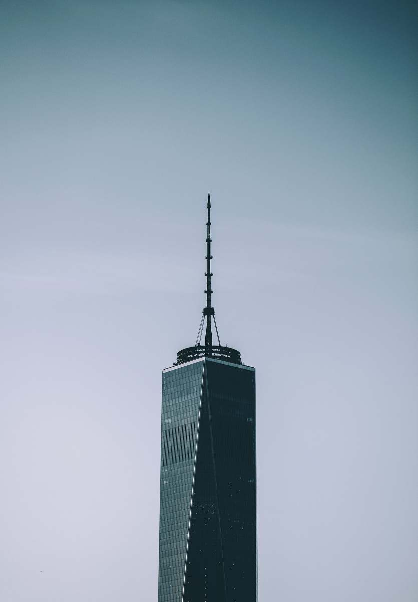 building gray painted building during daytime tower