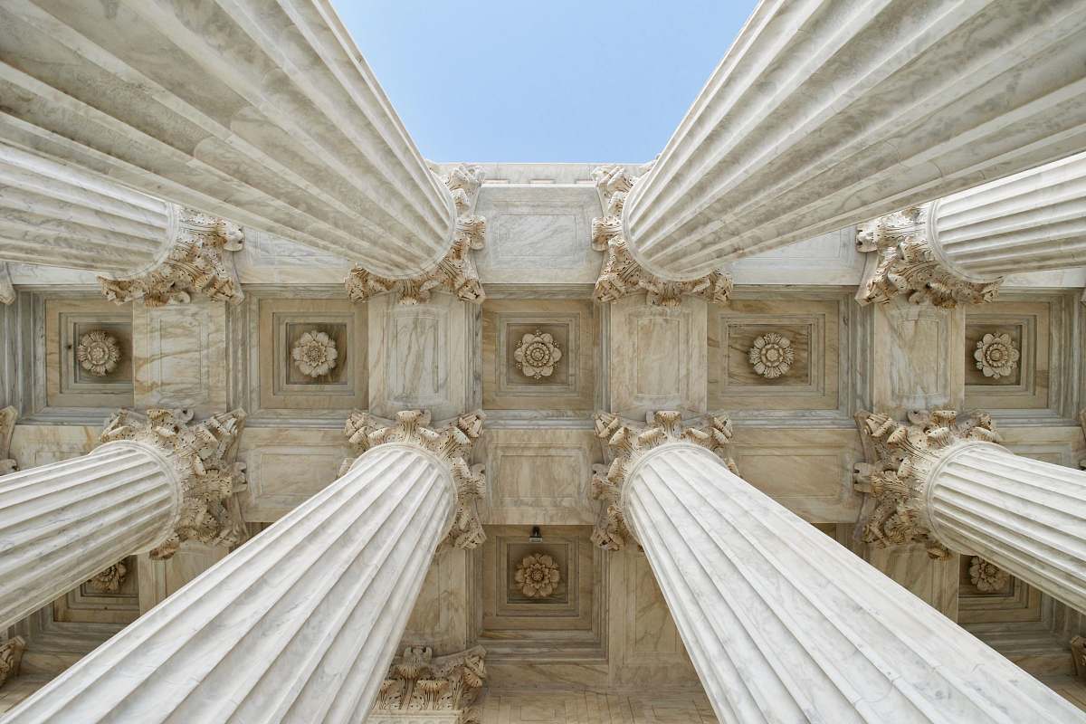 building gray stone columns worm's-eye view photo column