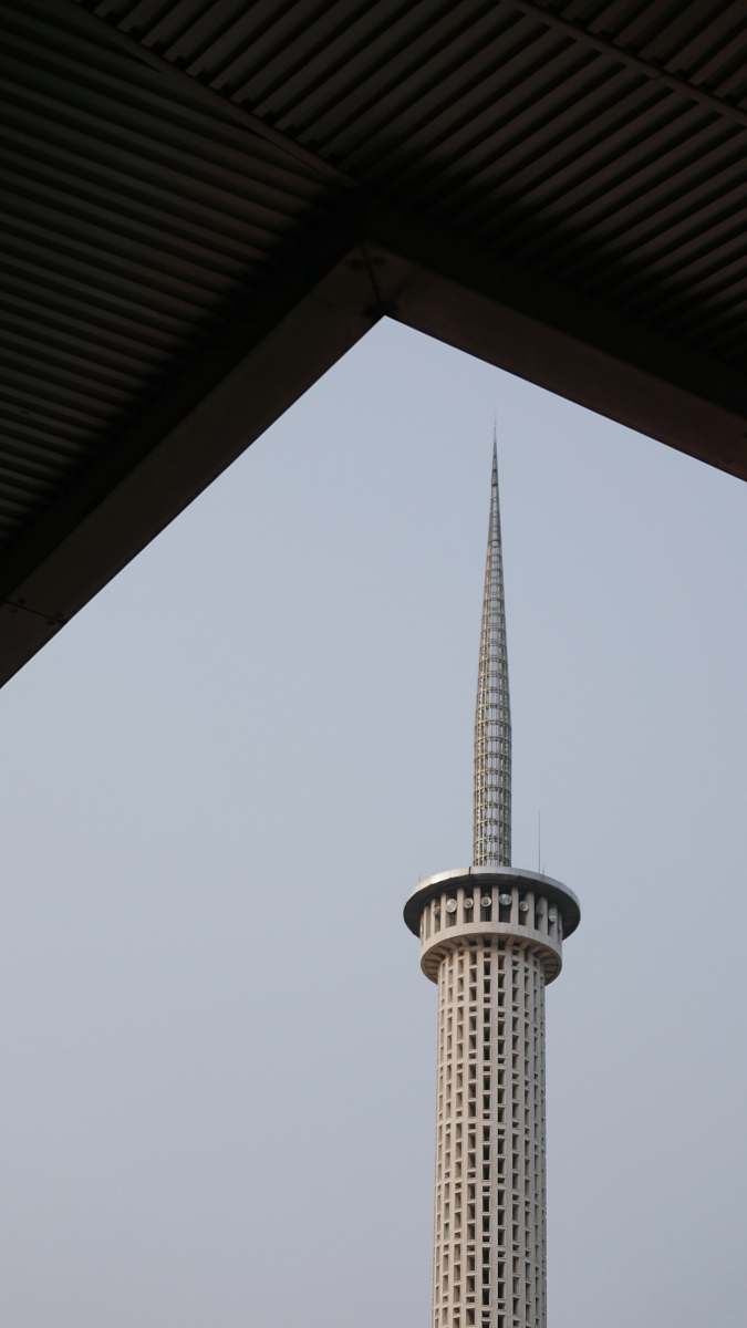 building gray tower under blue sky spire