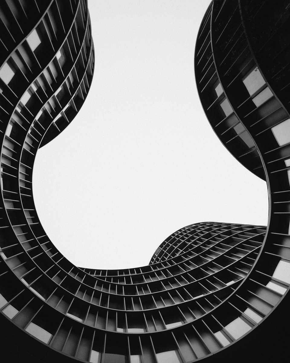 black-and-white grayscale photo of low angle view of building spiral