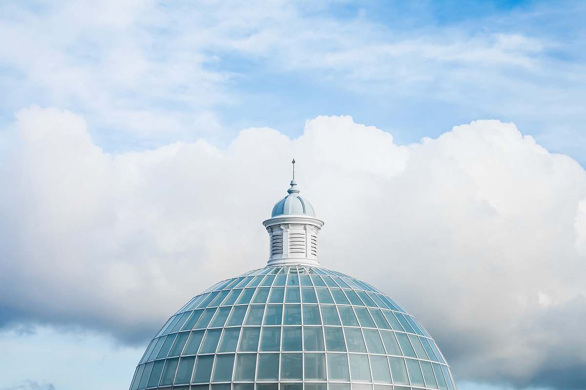 building green and white dome tower under white and blue sky at daytime dome