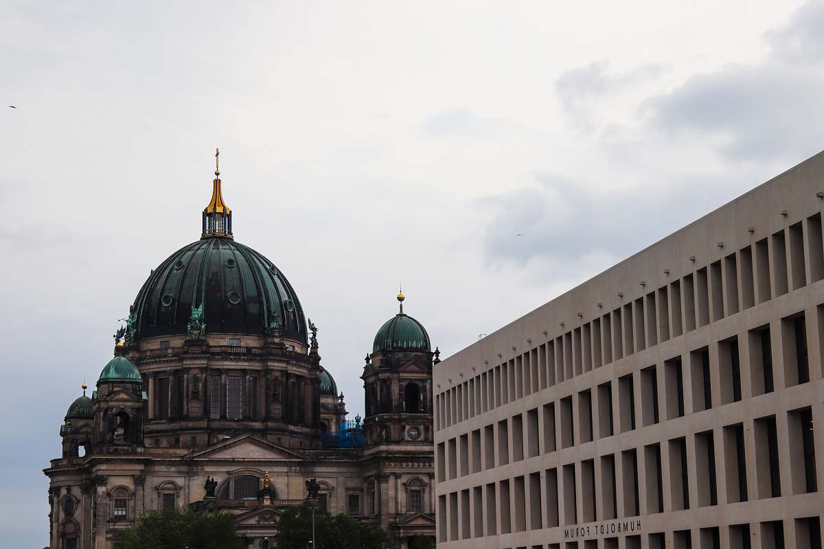 building green dome building near commercial building dome