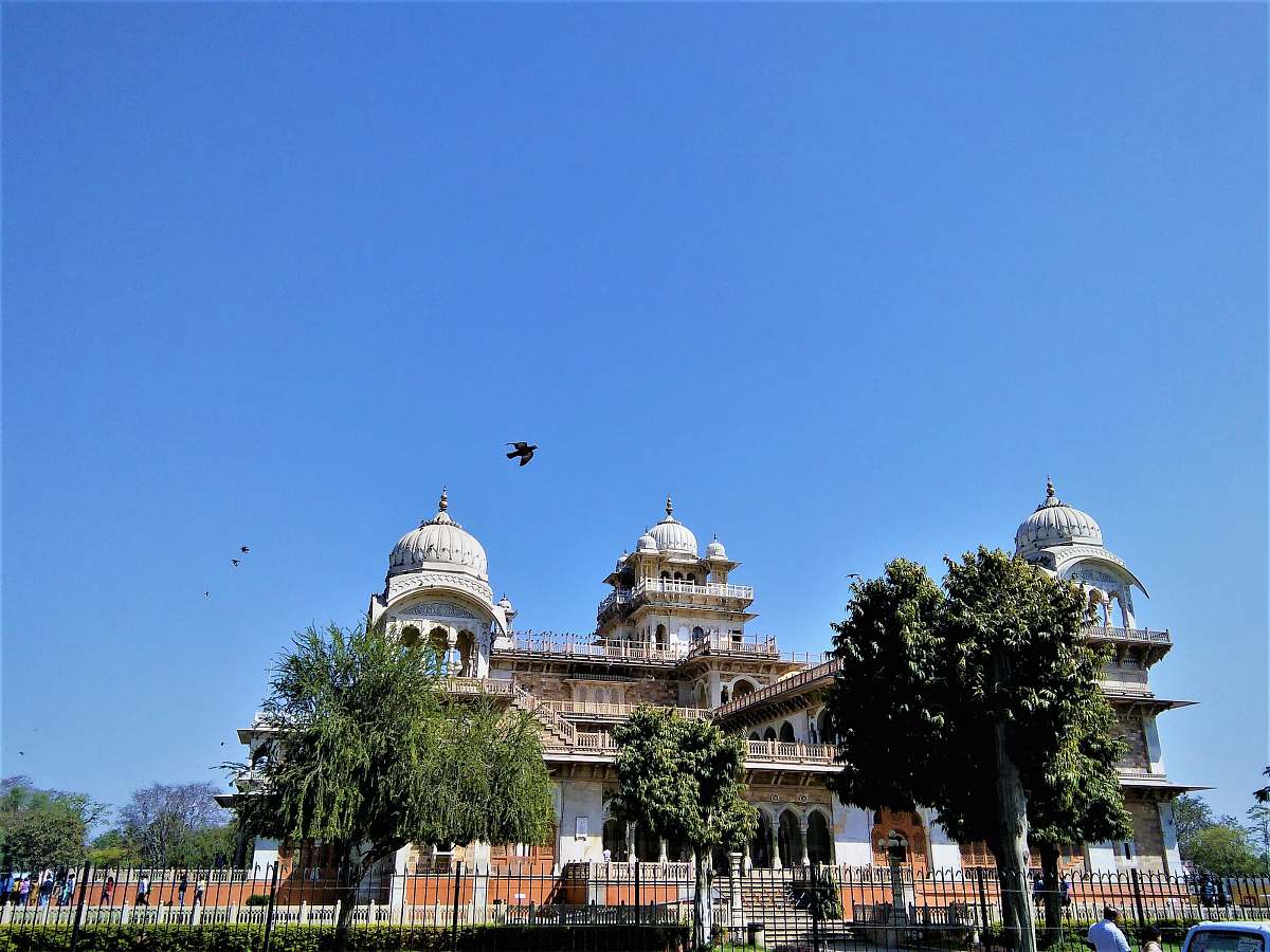 building green trees beside white concrete dome buildings dome