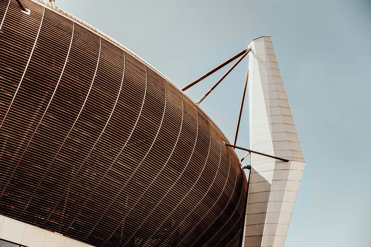 building grey coliseum with mesh planetarium