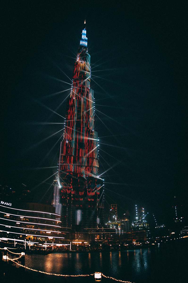 building high-rise building during nighttime spire