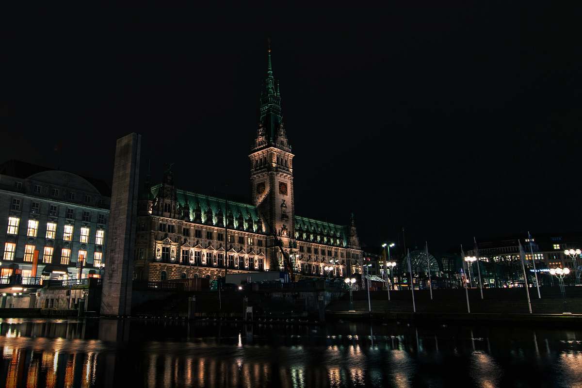 building lighted building with tower during night time tower
