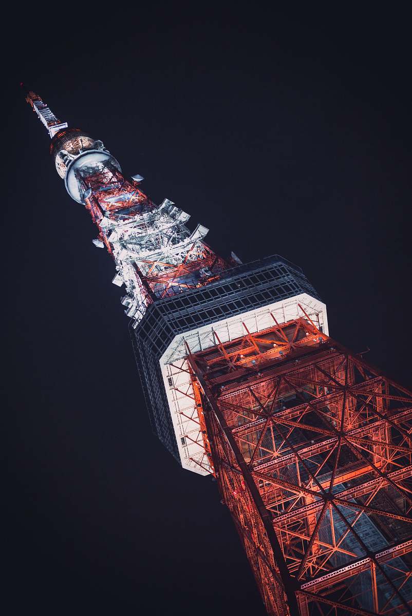 building lighted gray tower during nighttime tower