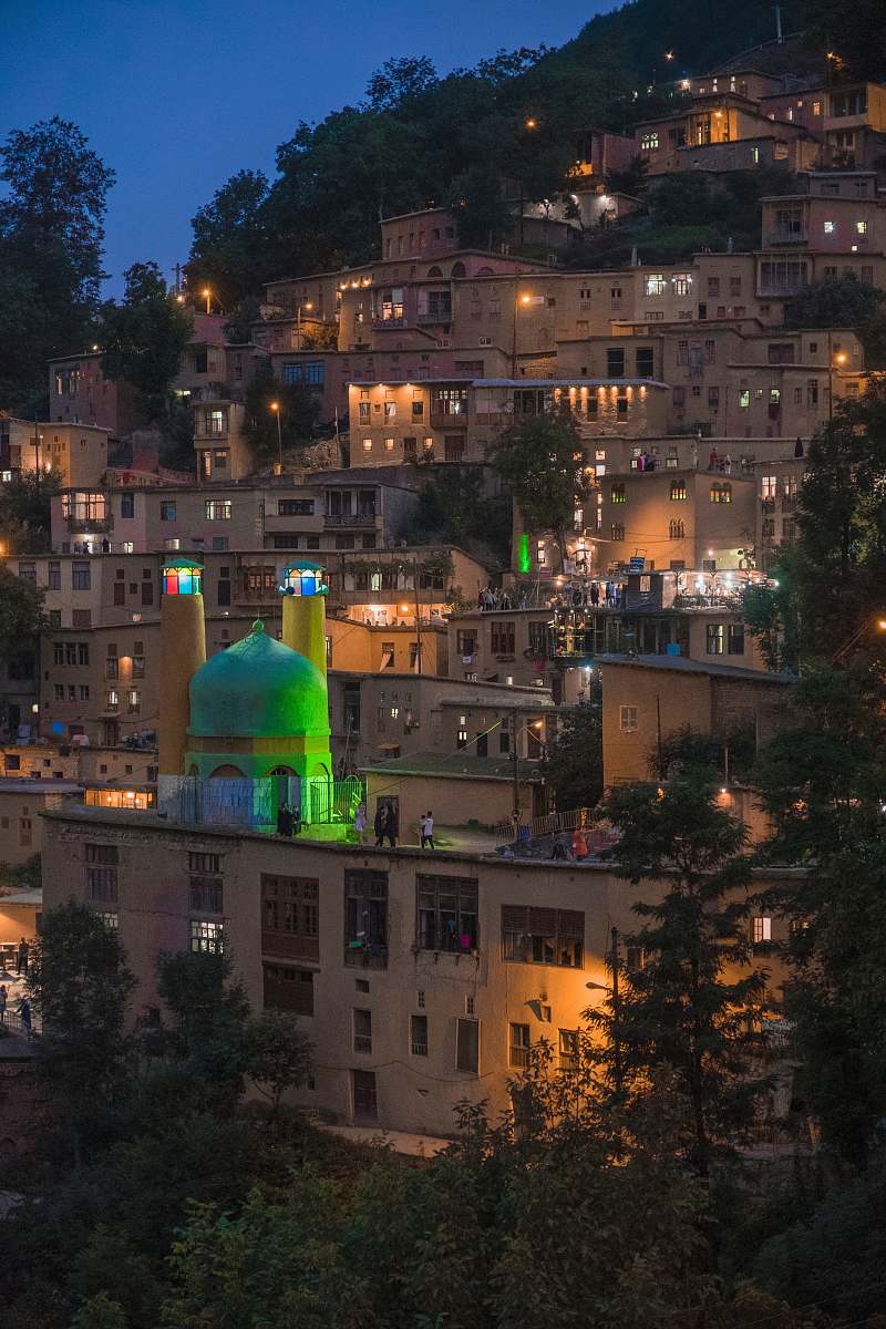 building lighted houses on hill dome