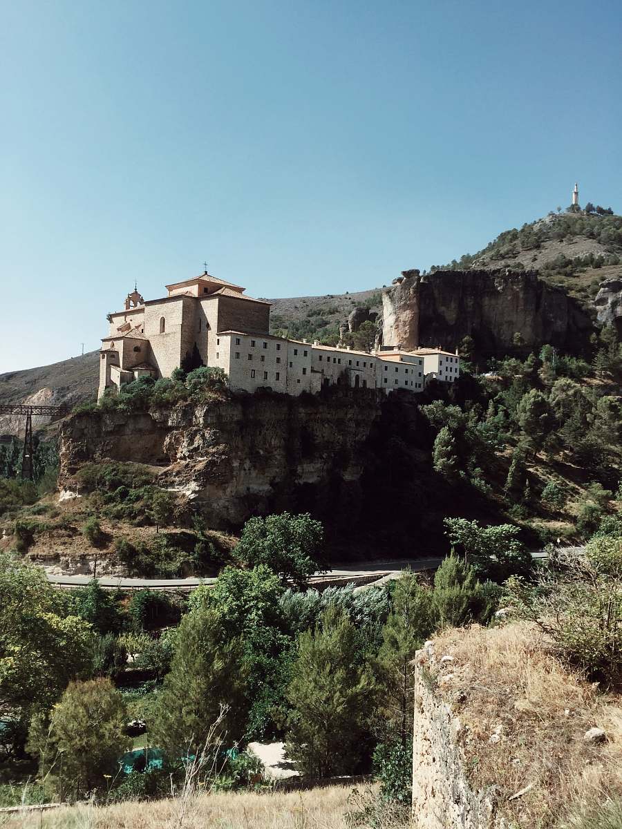 building low angle photo of castle surrounded by trees monastery
