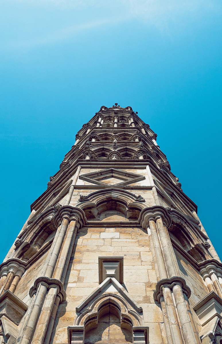 building low angle photo of concrete building tower